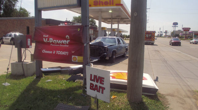 Car Crashes Into Convenience Store Sign